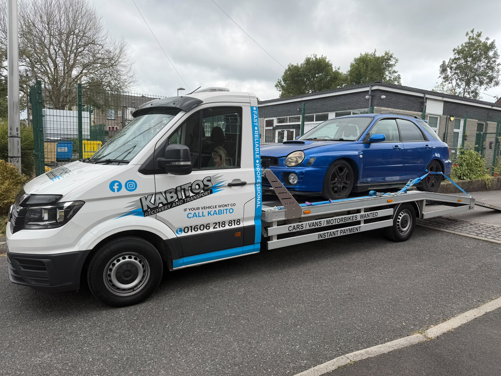 Kabito's recovery truck collecting a blue Subaru